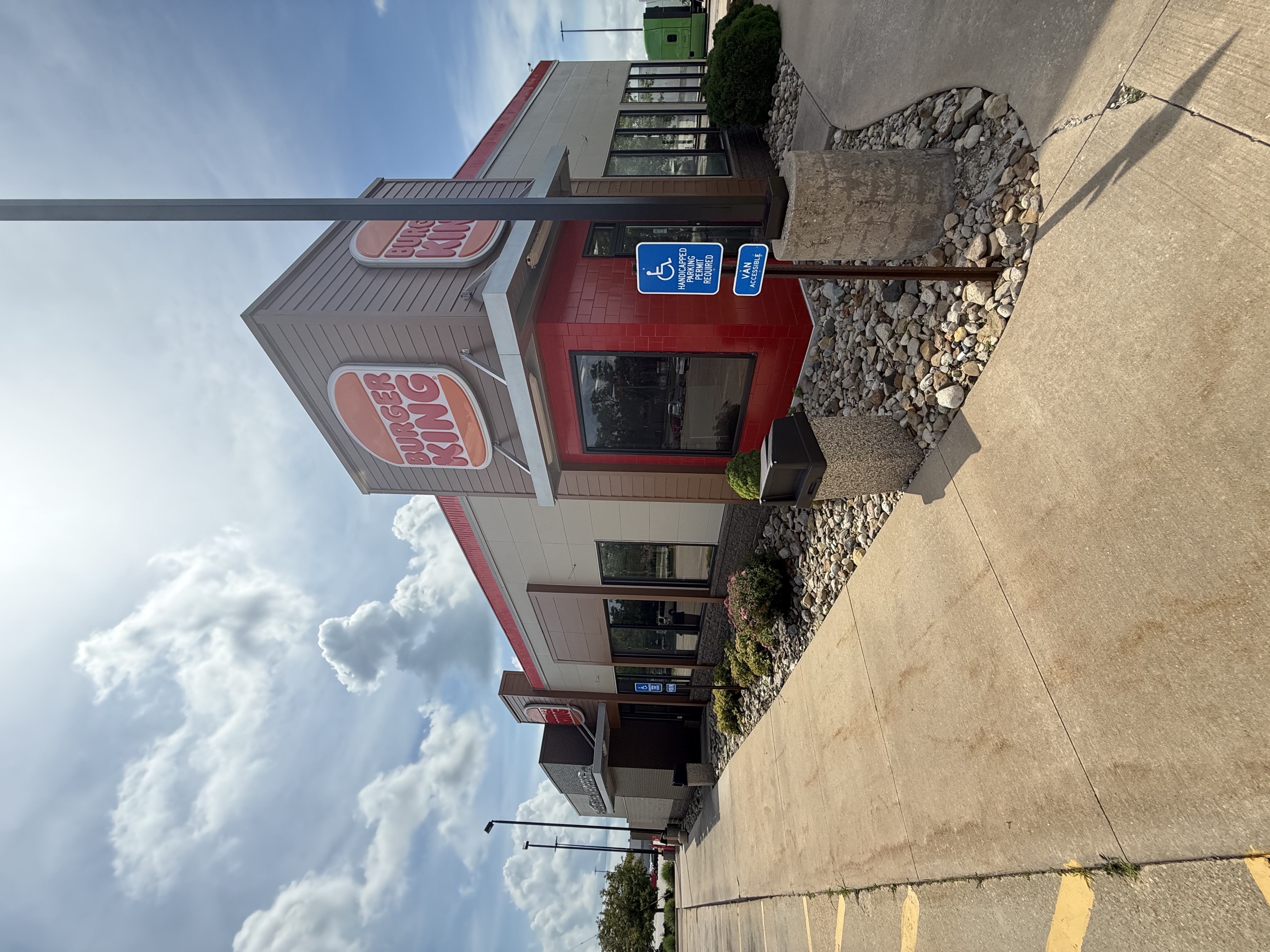 Completed Burger King exterior with fresh paint and stonework detailing by Maverick Painting
