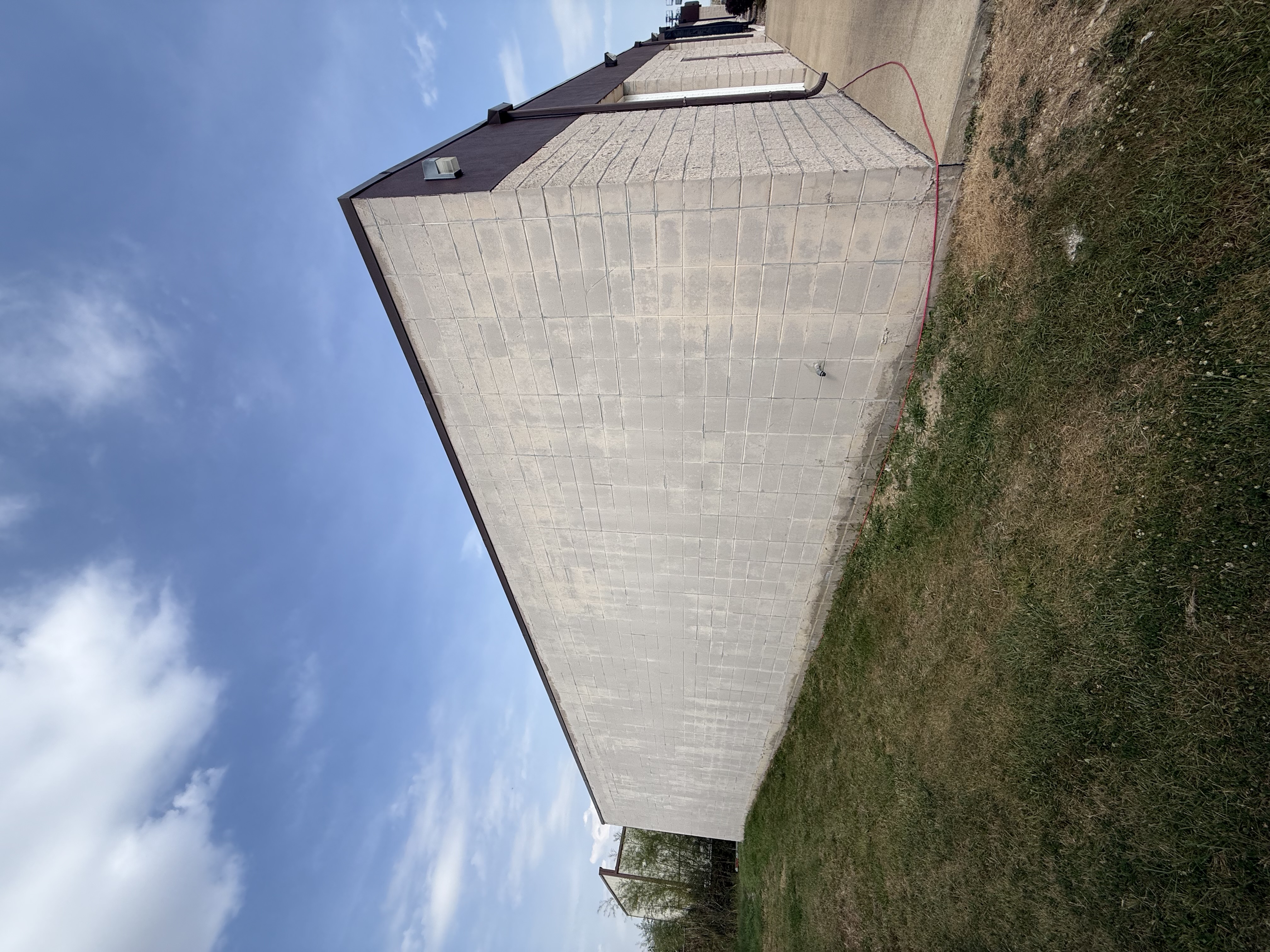 Before: Commercial building exterior, cinder block transformation