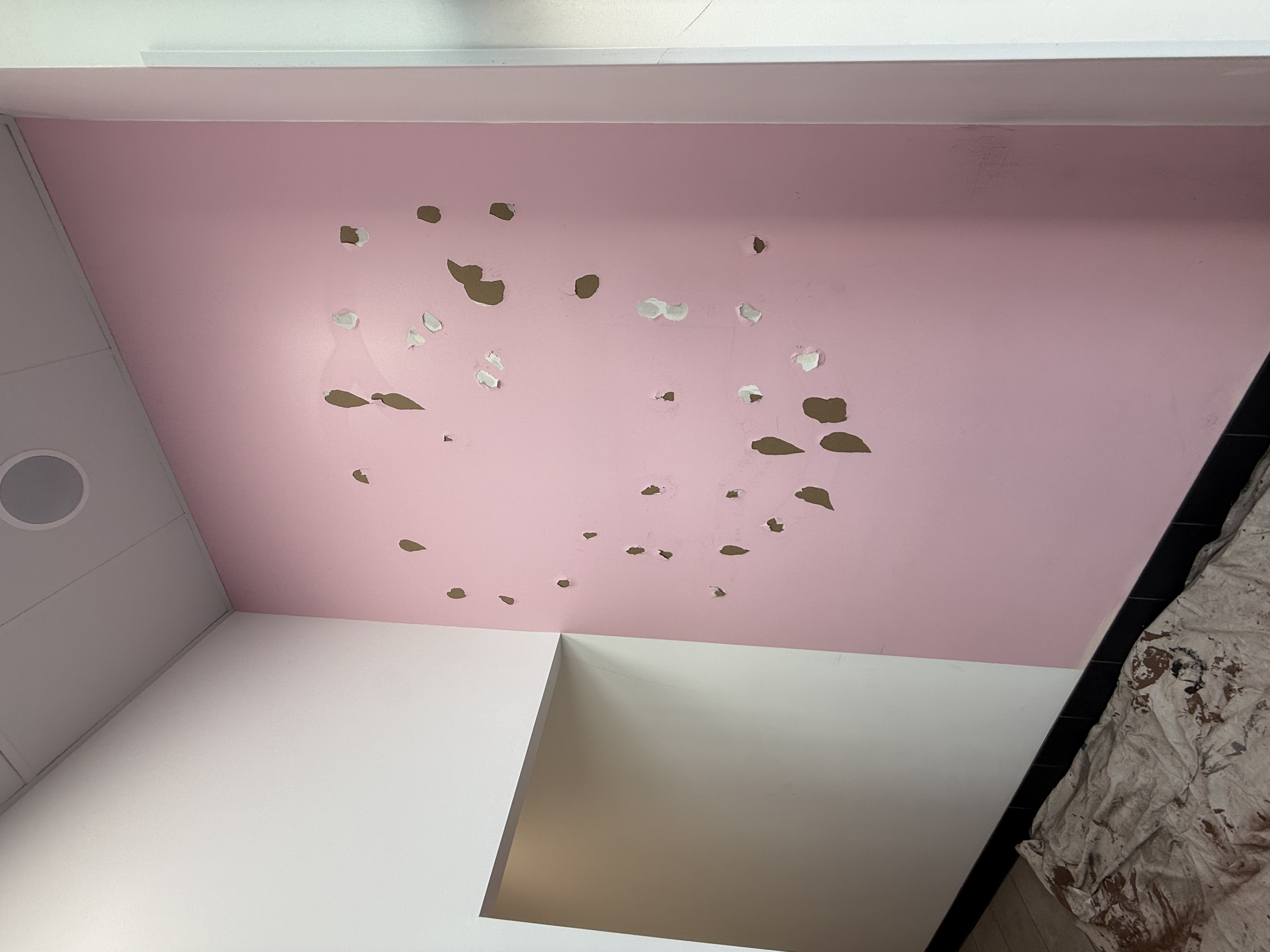 Before: Interior wall repair, pink accent